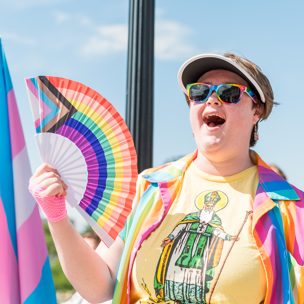 youth with rainbow fan
